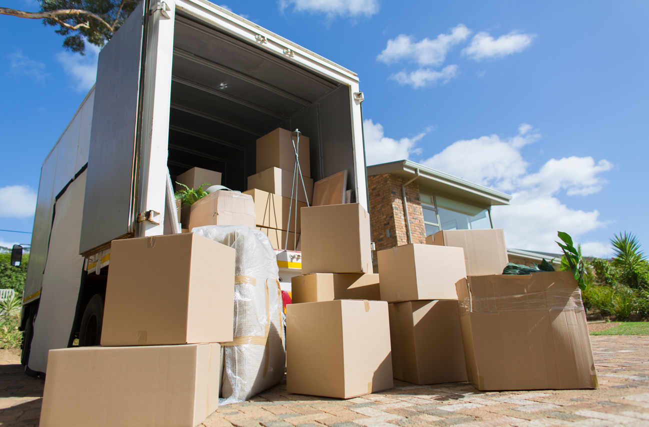 A moving truck with boxes of items.