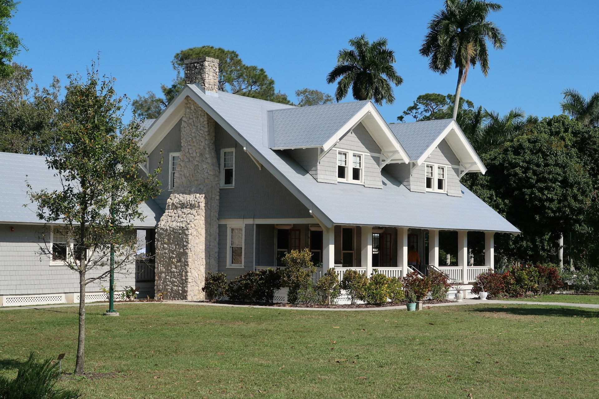 A sunny house with a large yard.