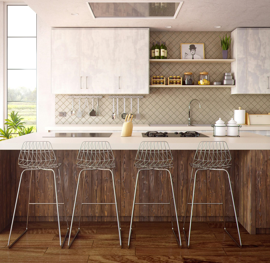 A clean, neutral-colored, and modern kitchen that's furnished.