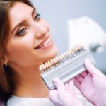 Lady smiling to find a color match for her veneers.