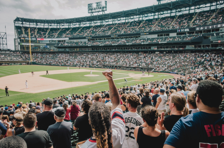 Audience view of a baseball game in an arena.