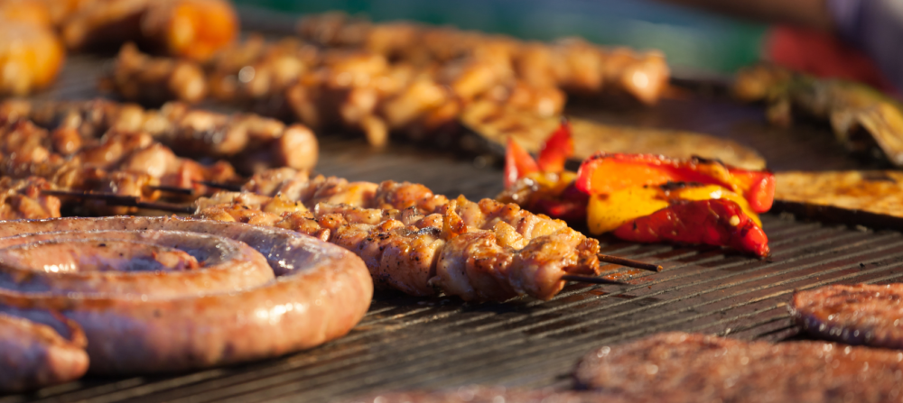 5 Must-Haves to Planning the Perfect Ladies’ BBQ Grill Night 1 Barbeque, sausages, and other meat on a gas grill.