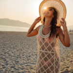 Tanned lady enjoying the sun in the beach.