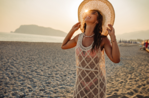 Tanned lady enjoying the sun in the beach.