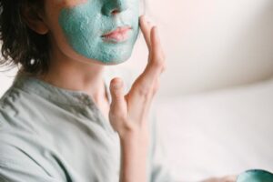 Woman putting on a face mask