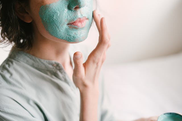 Woman putting on a face mask